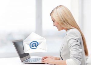 Application Hosting, woman using laptop computer to send email